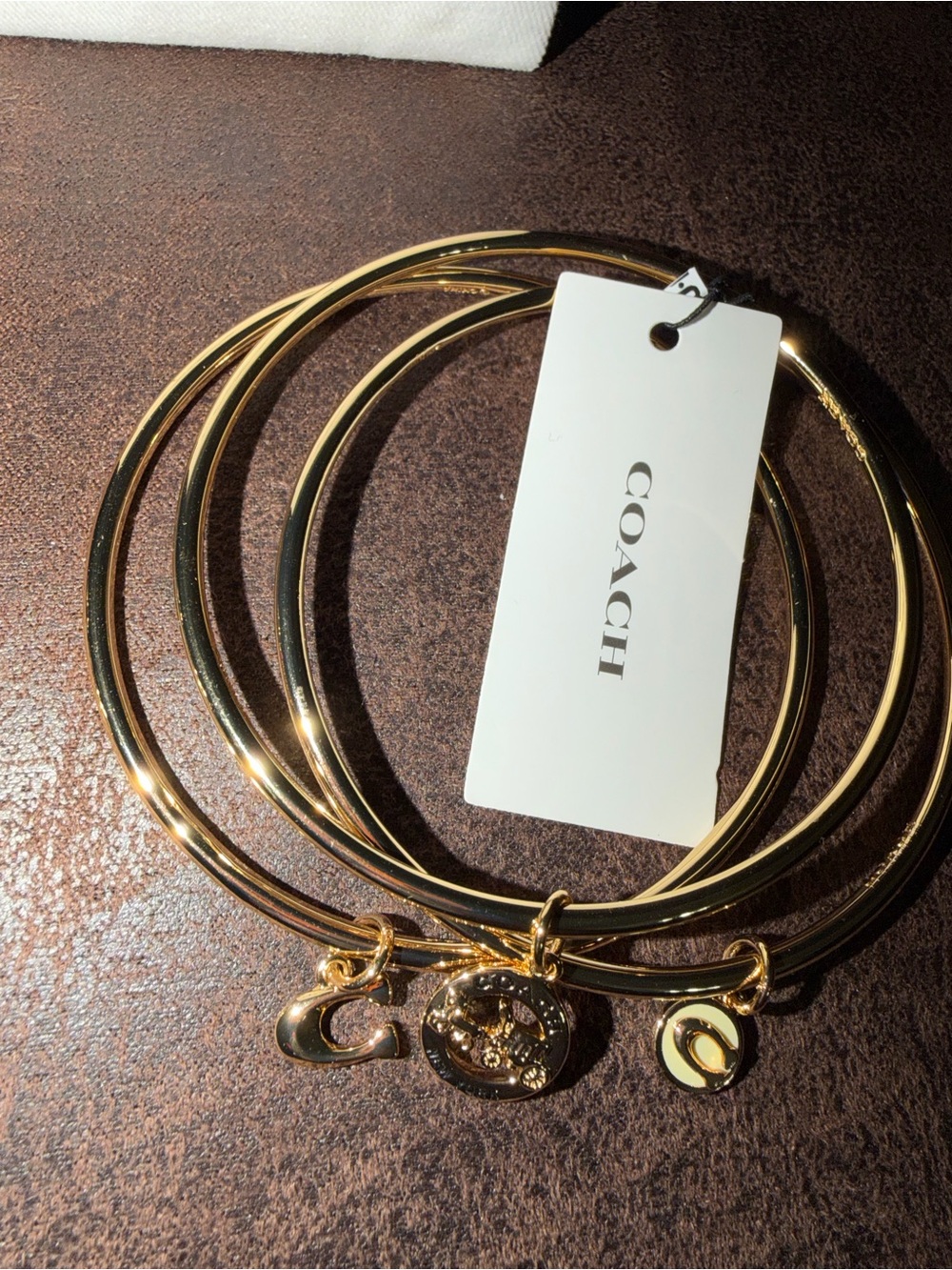 Coach Gold-Tone Triple Bangle Bracelet Set with Signature Charms